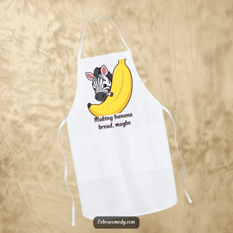 Funny apron with a curious zebra peeking playfully around a huge, comical banana, designed for chefs who love to laugh.