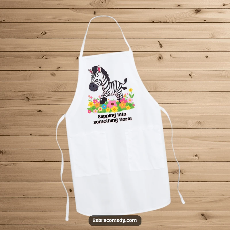 Funny apron with a zebra character comically falling on colorful flowers while cooking, a humorous kitchen accessory.
