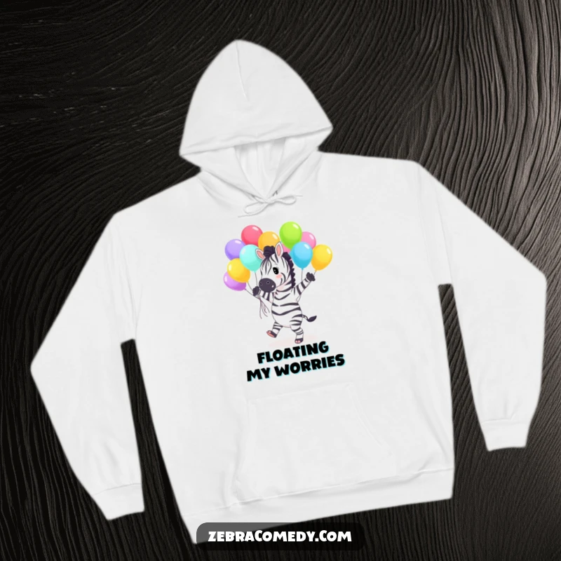 Funny Hoodie depicting a cheerful zebra character dancing with a vibrant cluster of colorful balloons, offering warmth and a dose of humor.