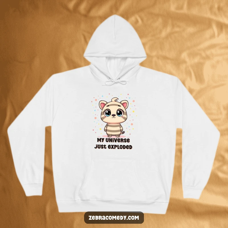 Funny hoodie depicting a striped character with intrigued eyes looking into a swirling confetti galaxy, blending cozy warmth with a sense of cosmic mystery.