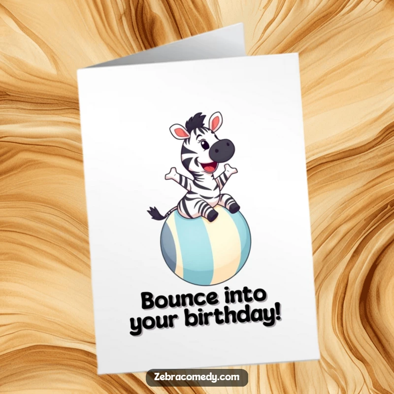 Funny free printable birthday card featuring a zebra joyfully bouncing high on a large, striped ball with a wide grin.