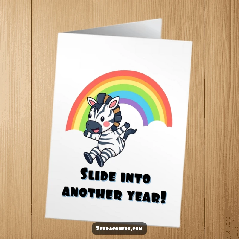 Funny Free Printable Birthday Card: A zebra gleefully slides down a bright rainbow, shouting with pure happiness.