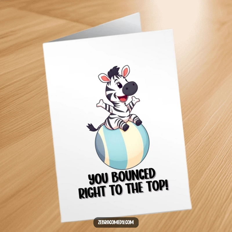 Free printable congratulations card showing a zebra joyfully bouncing on a big striped ball, grinning widely.