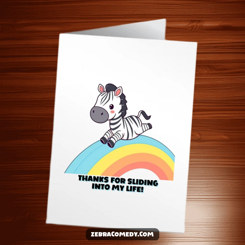 Funny Free Printable Thank You Card: A smiling zebra sliding down a striped rainbow, beaming with gratitude.