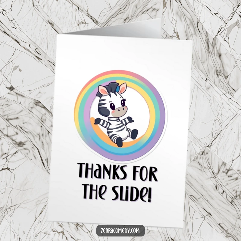 Funny Free Printable Thank You Card: A cartoon zebra excitedly sliding down a colorful rainbow, sending thanks with a whimsical flair.