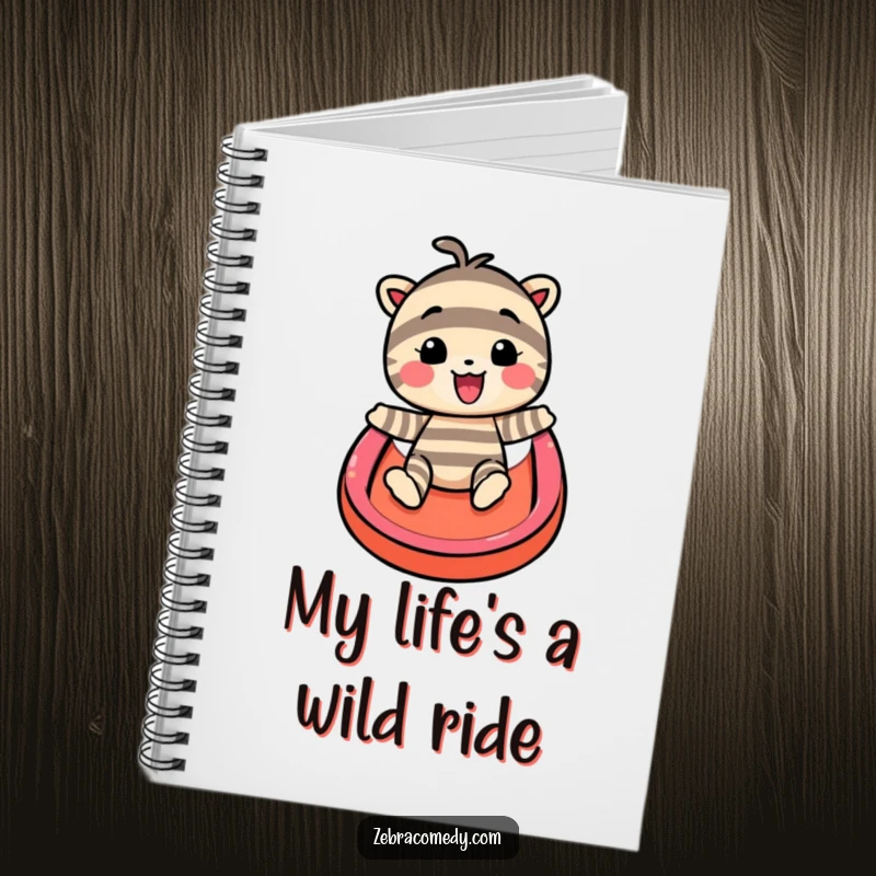 Funny notebook with a striped character gleefully descending a rainbow slide, inspiring creative writing and happy note-taking.