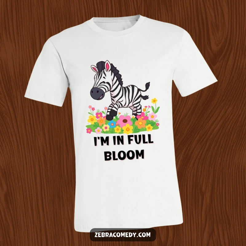 Funny t-shirt with a comical zebra character mid-fall on a bed of bright, cheerful flowers, expressing shock.